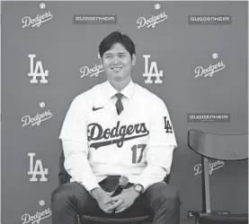  ?? ASHLEY LANDIS/AP ?? The Dodgers’ Shohei Ohtani answers questions during a news conference at Dodger Stadium on Dec. 14 in Los Angeles.