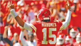  ?? AP PHOTO/CHARLIE RIEDEL ?? Kansas City Chiefs quarterbac­k Patrick Mahomes celebrates after his third touchdown pass of Sunday’s 38-27 home win against the San Francisco 49ers. Mahomes, a second-year pro and first-year starter, has set an NFL record for touchdown passes in the first three weeks of a season, with 13.