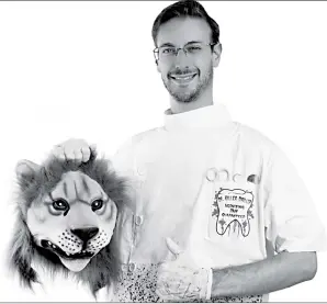  ?? Associated Press ?? A man wears a Dentists costume while holding a fake severed lion’s head, a costume referring to the Minnesota dentist who killed Cecil the lion. The Halloween wars over pop culture costumes heated up early this time around. Petitions and social media...