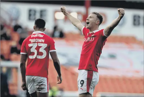  ?? PICTURE: BRUCE ROLLINSON ?? DELIGHTED: Cauley Woodrow celebrates scoring for Barnsley against Wycombe Wanderers last month. Woodrow scored both goals as Barnsley won 2-1.