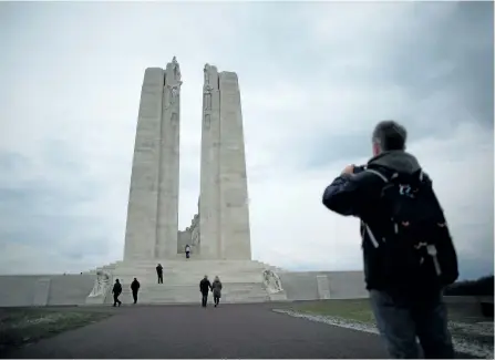  ?? PETER MACDIARMID/GETTY ?? Visitors walk towards the Canadian National Vimy Memorial on March 26, 2014 in Vimy, France. Students from local Catholic schools will visit the memorial in April.