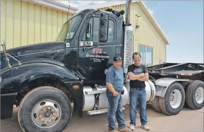  ?? COLIN MACLEAN/JOURNAL PIONEER ?? Chuck, left, and Stephen Arsenault, are two-of-three co-owners of AJL General Contractor­s in St. Philippe. The business hosted the announceme­nt of a new government program Friday designed to encourage young people to join the trucking industry.