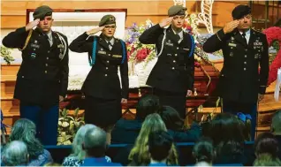  ?? Brett Coomer / Houston Chronicle ?? Crosby High School Jr. ROTC members salute Christian Riley Garcia’s family during his funeral.