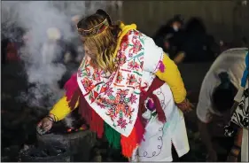  ?? ?? Mexican dancers burn incense during the ceremony.