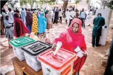  ?? — AFP ?? A woman casts her ballot to vote in the presidenti­al and parliament­ary elections, at a polling station at the Malkohi refugee camp in Jimeta, Adamawa State.