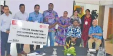  ?? Picture: REPEKA NASIKO ?? (L-R) Vodafone Fiji head of consumer applicatio­ns Deepak Baran and head of eCommerce, digital financial services, sponsorshi­p and corporate affairs Vodafone Fiji Ltd Shailendra Prasad with recipients of the $140,000 handover from the Vodafone ATH Fiji Foundation.