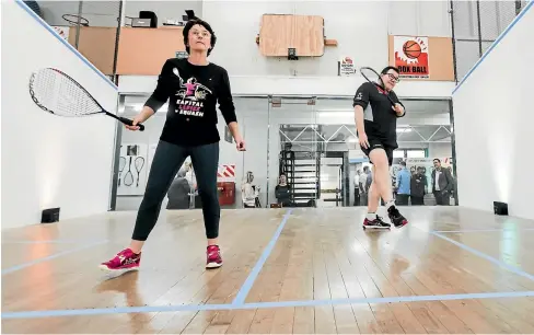  ?? ROSA WOODS/ STUFF ?? Dame Susan Devoy and Grant Robertson battle it out on the squash court at Club Kelburn.