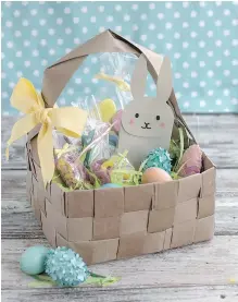  ??  ?? An upcycled DIY Easter basket made from four brown paper grocery bags, cut into strips and woven together. Fresh takes on Easter baskets