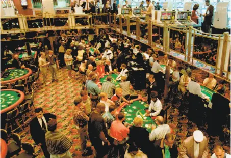  ?? Michael Conroy / Associated Press 1996 ?? Gamblers fill the tables on the Majestic Star Casino in Gary, Ind. The company acquired the Trump gaming boat in 2007.