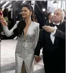  ??  ?? Catherine Zeta-Jones and Michael Douglas