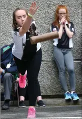  ??  ?? Ciara McEneaney from Magheraclo­one, Co Monaghan, throws the skittle to the standard during the Under 16 skittles final