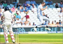  ??  ?? South Africa's Chris Morris celebrates as he clean bowled England captain Joe Root for 8 runs at Trent Bridge cricket ground.