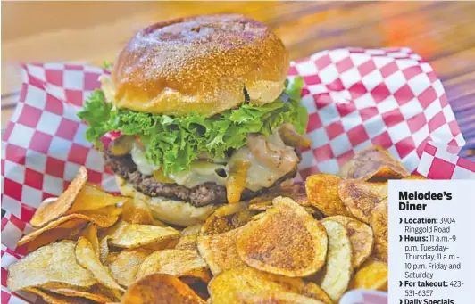  ?? PHOTOS BY DAVID HUMBER ?? Melodee’s Jacked Up Burger with pepper jack and smoked cheddar cheese, fried jalapenos, tomato and onions.
www. facebook.com/pg/ Melodees-Diner36715­3007241040/ posts/?ref=page_ internal