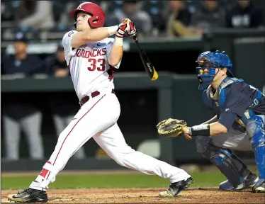  ?? NWA Democrat-Gazette/ANDY SHUPE ?? Arkansas catcher Grant Koch finished 2 for 4 with 3 RBI, including a two-run home run in the fifth inning, to help the Razorbacks hold off New Orleans 5-2 on Wednesday night in front of a crowd of 2,626 at Baum Stadium in Fayettevil­le.