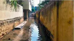  ??  ?? DC Sewage flows through a lane in the Begumpet area after the massive leak from a pipeline on Tuesday afternoon. —