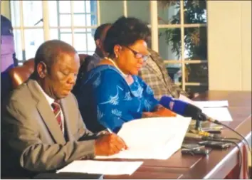  ??  ?? MDC-T leader Morgan Tsvangirai and Joice Mujuru sign their Memorandum of Understand­ing at the former’s residence in Harare last week