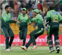  ?? Photo by Ryan Lim ?? Faheem Ashraf (left) and teammates celebrate the dismissal Sri Lanka’s Sadeera Samarawick­rama. —