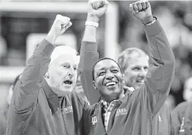  ?? Justin Casterline / Getty Images ?? Bob Knight, left, with Isiah Thomas, celebrates his return to Assembly Hall for the first time in 20 years during halftime of the Indiana-Purdue game.