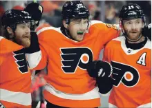  ?? TOM MIHALEK THE ASSOCIATED PRESS ?? “It meant a lot for me to play for the Maple Leafs. I enjoyed my time there,” says Philadelph­ia Flyers’ James van Riemsdyk, centre.