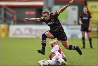  ??  ?? Orlaith Conlon hurdles over Lina Salmi of Ajax in Seaview, Belfast, on Tuesday.