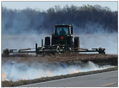  ?? (Arkansas Democrat-Gazette/Colin Murphey) ?? A farmer harrows a field near England on Monday to prepare it for planting.