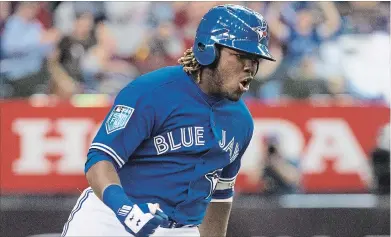  ?? THE CANADIAN PRESS FILE PHOTO ?? Vladimir Guerrero Jr. celebrates his walk-off home run that beat the St. Louis Cardinals, 1-0, in spring training in Montreal.