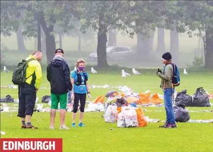  ??  ?? Beauty spot gone to rot: Bags full of litter being collected at the Meadows by volunteers