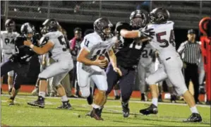  ?? BARRY TAGLIEBER - FOR DIGITAL FIRST MEDIA ?? Pottsgrove quarterbac­k Jay Sisko rolls out of the pocket Friday against Phoenixvil­le.