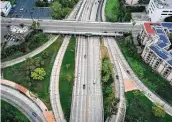  ?? Tribune News Service file photo ?? The pandemic curbed traffic, like this Los Angeles scene, contributi­ng to a big drop in emissions.