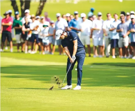  ?? AP PHOTO/BRYNN ANDERSON ?? Patrick Cantlay hits off a fairway during the final round of the Tour Championsh­ip on Sunday at East Lake Golf Club in Atlanta.