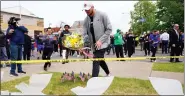  ?? AP PHOTO/MATT ROURKE ?? Buffalo Bills’ Josh Allen visits the scene of Saturday’s shooting at a supermarke­t, in Buffalo, N.Y., on Wednesday.