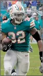  ?? AP/LYNNE SLADKY ?? Kenyan Drake runs the last 52 yards as the Miami Dolphins scored on a pass and double lateral on the final play Sunday to beat the New England Patriots 34-33 in Miami Gardens, Fla.