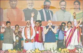  ?? ?? Prime Minister Narendra Modi and BJP leaders greet supporters during a public meeting for the seventh and last phase of UP Assembly elections in Varanasi on Saturday.