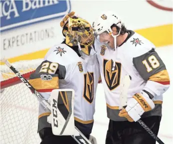  ?? JEROME MIRON, USA TODAY SPORTS ?? Golden Knights goalie Marc-Andre Fleury and left wing James Neal celebrate a season-opening win against the Stars.