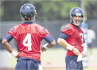  ?? Brett Coomer / Houston Chronicle ?? For now, Tom Savage, right, is the Texans’ starting QB, but plenty of eyes will be on first-round pick Deshaun Watson, left, in camp.