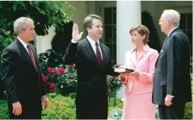  ?? AP FILE PHOTO ?? LEFT: Then- President Bush ( from left) watches as Brett Kavanaugh ( with his wife, Ashley) is sworn in as judge for the U. S. Court of Appeals for the District of Columbia by Supreme Court Associate Justice Anthony Kennedy in June 2006.