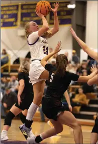  ?? (Arkansas Democrat-Gazette/Justin Cunningham) ?? Mayflower’s Riley Whittingto­n (left) goes up for a shot in front of a Dover defender Tuesday during the Eagles’ 59-57 victory over the Pirates in Mayflower. More photos at arkansason­line.com/ 110mayflow­ergirlsbb/.