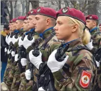  ?? AP PHOTO ?? Members of the police forces of the Republic of Srpska march during a parade marking the 26th anniversar­y of the Republic of Srpska in the Bosnian town of Banja Luka on Tuesday.