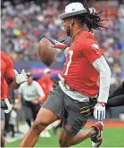  ?? DAVID BECKER/AP ?? Davante Adams pitches the football back during a flag football game.