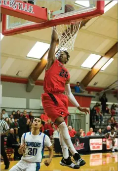  ?? RECORDER PHOTOS BY CHIEKO HARA ?? Portervill­e College's Malik Mccowan dunks Wednesday during the second half against Oxnard College at their first home game. McCowan finished with 27 points.