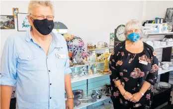  ?? ?? Scott (left) and Penny Lancaster are passionate workers at Levin’s Red Cross Op Shop.