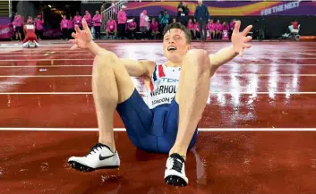  ??  ?? Karsten Warholm celebrates after winning the men’s 400m hurdles gold in London on Wednesday.