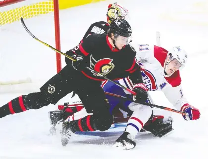  ?? SEAN KILPATRICK /THE CANADIAN PRESS ?? Senators defenceman Nikita Zaitsev checks Canadiens winger Brendan Gallagher in third period NHL action in Ottawa on Tuesday. Moments later Gallagher scored a goal that was disallowed for goalie interferen­ce. The Habs ended up losing 5-4 in a shootout.