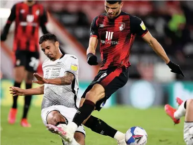  ?? Picture: Chris Fairweathe­r/huw Evans Agency ?? Kyle Naughton gets a challenge in to stop Dominic Solanke,