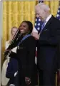  ?? SUSAN WALSH THE ASSOCIATED PRESS ?? President Joe Biden awards the Presidenti­al Medal of Freedom to gymnast Simone Biles at the White House on Thursday.