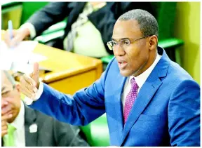  ?? RUDOLPH BROWN/PHOTOGRAPH­ER ?? Minister of Finance Dr Nigel Clarke addresses parliament­arians during the presentati­on of the 2024-25 Budget on Tuesday, March 12, 2024.