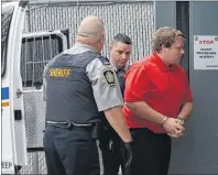  ?? CAPE BRETON POST PHOTO ?? James Clayton MacDonald of Point Aconi is led into Sydney Provincial Court in this file photo from August 2016.