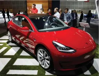  ?? BLOOMBERG ?? Elon Musk says Tesla remains on track to meet its goal to build 5,000 Model 3 sedans a week by the end of June.