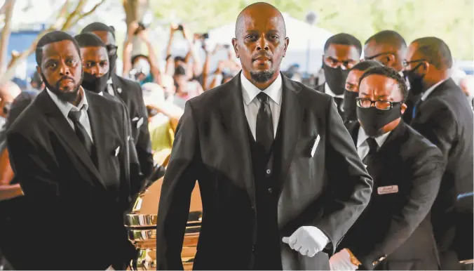  ??  ?? Pallbearer­s bring the casket into The Fountain of Praise Church, Houston, for George Floyd’s funeral on Tuesday.