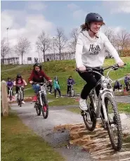  ??  ?? Pedal power Children using a pump track for BMX and mountain bikes in Larbert, Forth Valley. The track was designed and built by the Central Scotland Green Network Trust (CSGN) who plan a similar track in Wishaw
